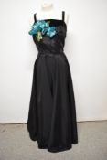 A 1950s black taffeta evening gown, having velvet band to bodice and velvet straps, with blue velvet