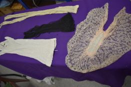 A pair of late Victorian fingerless mitts, a pair of 1920s white gloves, a pair of 1930s black net