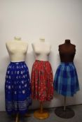 Three vintage skirts, to include; 1940s blue cotton skirt with white floral pattern, 1950s blue