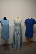 A late 1940s/1950s duck egg blue ball gown, having gold braided bow details to front of skirt and