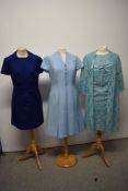 Three vintage 1960s dresses in shades of blue, including lace two piece dress and jacket.