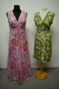 A 1950s / 1960s day dress having abstract rose pattern in blue, brown, green and white with side