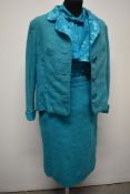 An amazing turquoise blue early 1960s three piece suit, comprising skirt and jacket with matching
