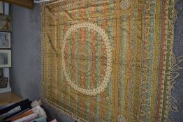 A vintage ethnic throw or bed coverlet.