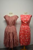 A late 1940s rose pink grosgrain dress, having tiered skirt and original belt, sold with a 1950s