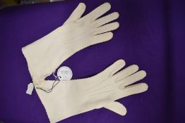 A pair of vintage white gloves, bearing Sotherby's label from the Duke and Duchess of Windsor