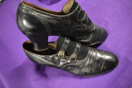 A pair of Edwardian black leather and suede shoes, having buckle detail to front.