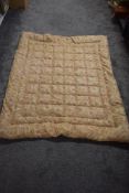 A 1930s pale pink paisley eiderdown.