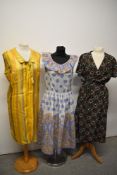 Three 1960s to 1970s dresses, including pretty pastel coloured dress with ruffled neckline, yellow