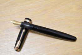 A Parker Duofold button fill fountain pen in black with decorative band to the cap having Parker
