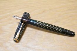 A Parker Vacumatic Junior, vacumatic plunger fill fountain pen in Emerald Pearl with two narrow