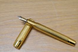 An Onoto University of Cambridge limited edition fountain pen 5/100 in vermail 23ct gold plate on