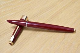 A Parker 17 Super aero fill fountain pen in burgundy with broad band to the base of the cap