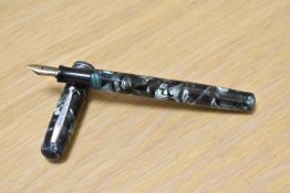 A Waterman Junior lever fill fountain pen in green marble with single narrow band to the cap