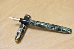 A Conway Stewart 85 lever fill fountain pen in green marble with single band to the cap having
