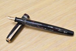 A Parker Duofold Geometric button fill fountain pen in in red, silver and black striated pattern
