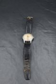 A gent's vintage steel cased wrist watch by Omega having baton & Arabic numeral dial in plain case