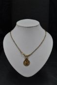 A yellow metal belcher link watch chain bearing plaque marked 9C with a 9ct rose gold medallion,