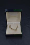A pair of 14ct gold earrings having loop fittings with brushed gold drops, approx 1.7g