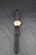 A 9ct gold wrist watch by Sovereign having Roman numeral and baton dial with date aperture to
