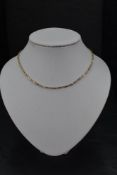 A 9ct gold fancy link chain with safety chain, approx 16' & 8g