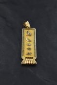 An 18ct Egyptian gold hieroglyphics pendant possibly spelling the name Avril, approx 9.3g