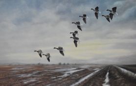 After Ian Phipps (b.1946, British), coloured print, Wildfowl flying over a saltmarsh, signed to