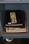 A small collection of stamp albums containing commemorative stamps, for Queen Elizabeth II, world