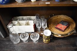 A Mid century circular brass mounted two-handled and galleried rattan drinks tray in the style of