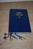 A 1978 dated Catholic song book, in Latin, having white metal bookmark charms.