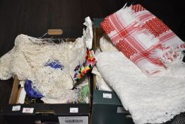 An assortment of vintage table linen, oriental bags, handkerchiefs and embroidered cushion cover