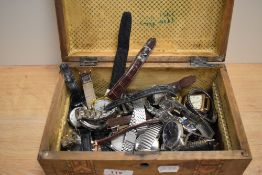 A Victorian parquetry inlaid table box containing various gentleman's wristwatches, including