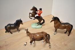 A Beswick Pottery Huntsman on Rearing Horse, model number 868, style two, designed by Arthur
