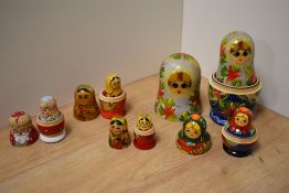A group of five Russian hand-decorated Matryoshka dolls, of traditional form, one poker worked and