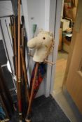 Vintage snooker cue and a selection of useful sticks, a vintage umbrella and a hobby horse toy.