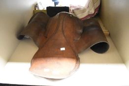 A leather saddle, of traditional design