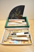 A collection of various Chinese/Oriental fans, various with hand-painted or pierced leaves, some