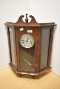 A traditionally styled glass and wood cased 'Reflex' wall clock, having 31 day movement.