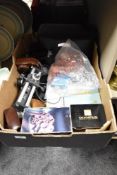 A box containing photographic equipment including Bellows, Light meters, Grips, Flash guns,