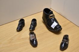 Two pairs of ornamental miniature clog oraments, together with a similar larger clog, one pair of