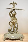 A cast-brass figural stick/umbrella stand, of Victorian design with scrolled foliate decoration,