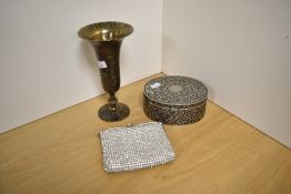 A Benares brass vase, of elongated bell form with short knopped stem and circular conical foot,