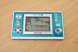 A CDL Nintendo 1982 Game & Watch Donkey Kong JR electronic game, model no DJ-101