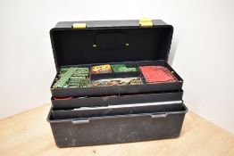 A collection of mixed vintage Meccano in a plastic tool box with three shelves