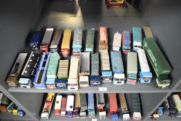 A shelf of Corgi and similar die-casts, Wagons, Articulated Trucks, etc