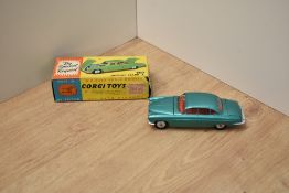 A Corgi die-cast, 238 Jaguar Mark X, metallic green, suitcases missing, in original box
