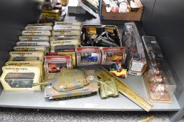 A shelf of mixed vintage die-casts including Corgi 41 1902 State Landau, 1977 Coronation Coach,