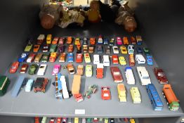 A shelf of playworn die-casts, Corgi, Spot-On, Dinky, Guisval etc, most in good condition with