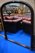 A mahogany effect overmantel mirror