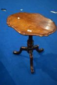 An early 20th Century oak occasional table having shaped top, width approx. 51cm